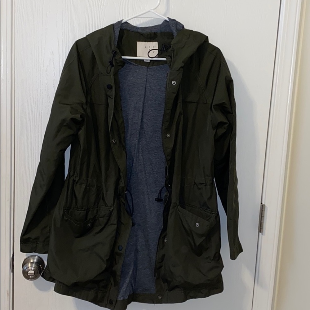 Green jacket with adjustable hood and waist